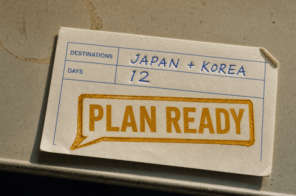 A paper airline arrival card, its Destinations field filled in by hand as Japan + Korea and Days as 12, with a gold stamp shaped like a chat message reading PLAN READY.